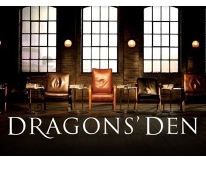 Empty leather chairs in a row with the words Dragons' Den beneath
